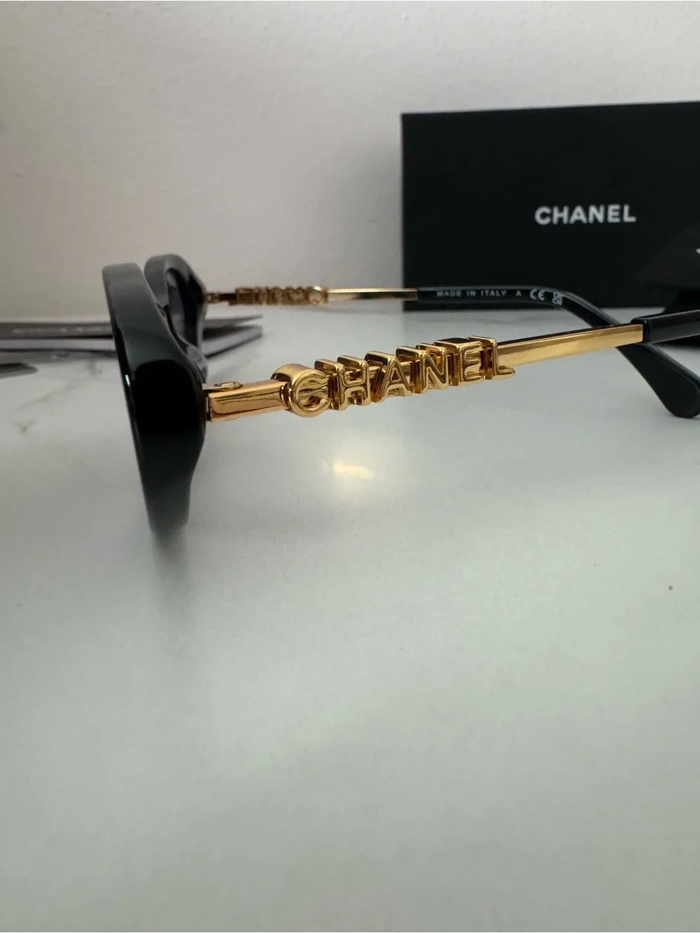 CHANEL Black Oval Sunglasses with Gray Gradient Lenses